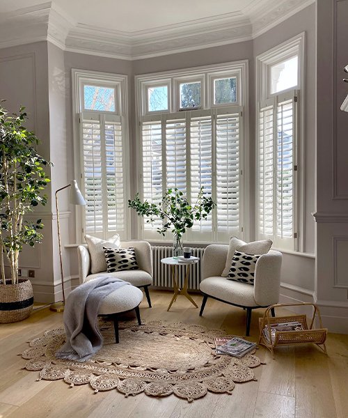 3. Bay window with storage units in living room